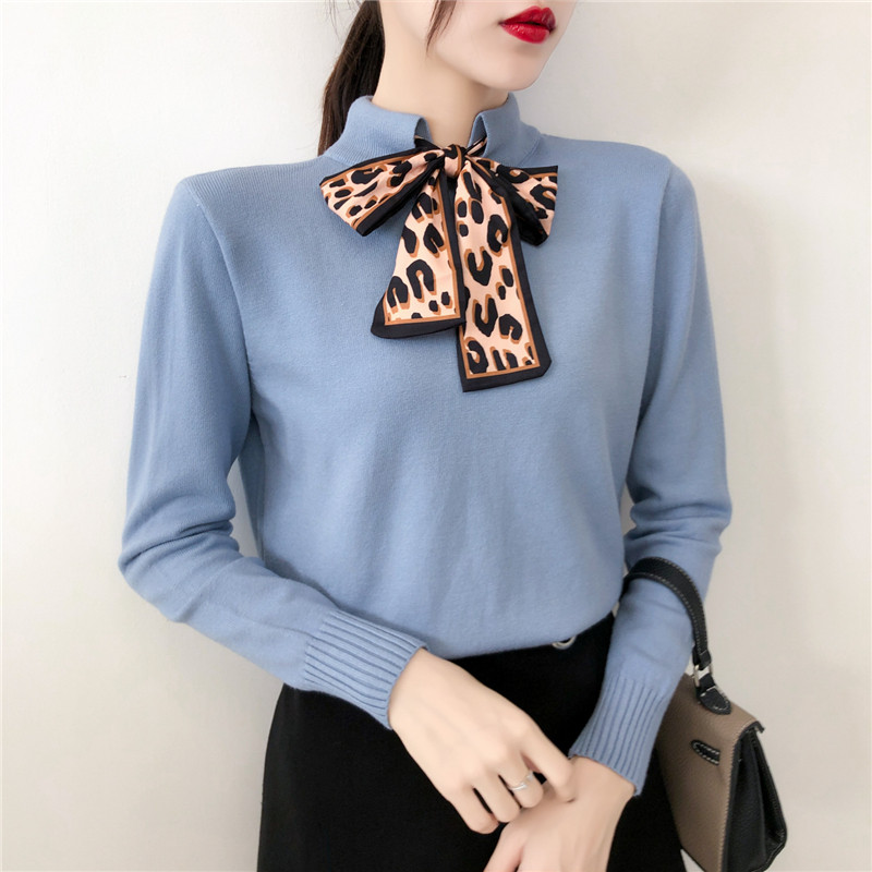 Stílusos női pulóver gallérján szalaggal több színben