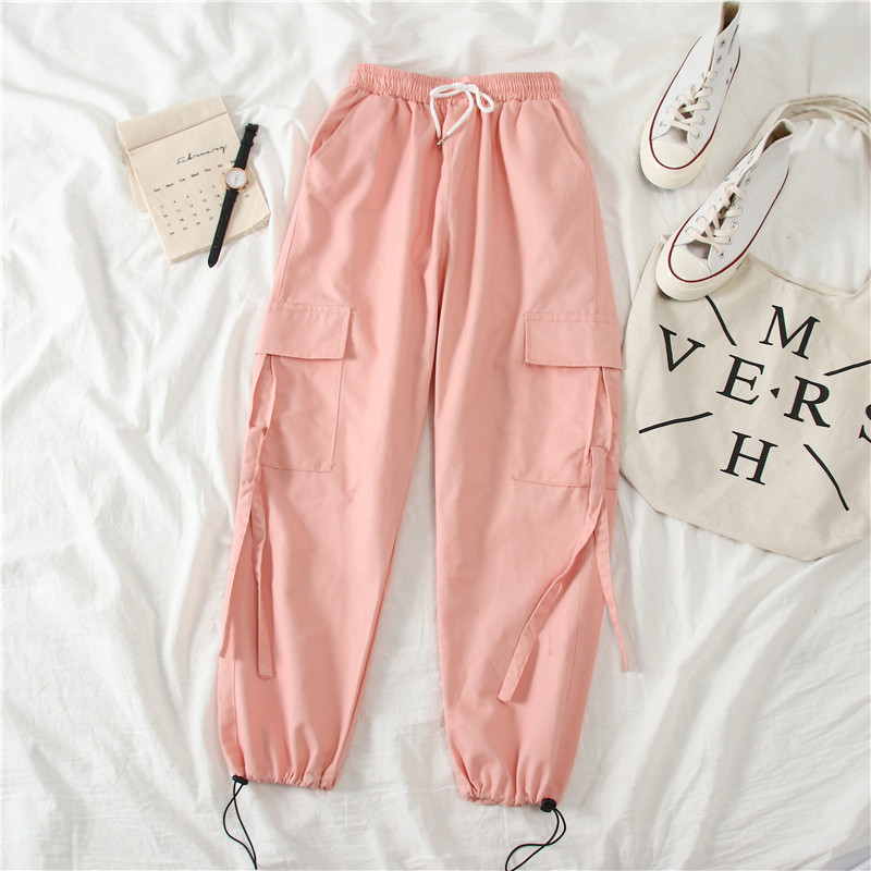 Női sportnadrág fekete és rózsaszín zsebekkel