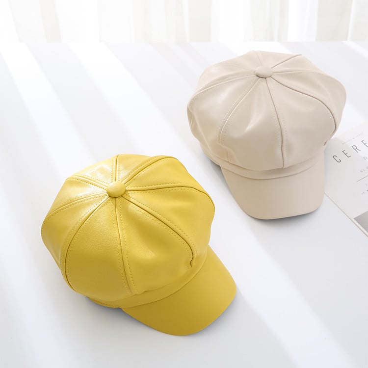 Stylish women`s leather caps in beige, yellow, black, red and orange