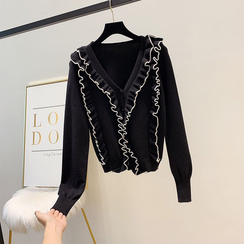 Modern női pulóver spitz nyakkivágással, fehér és fekete színben