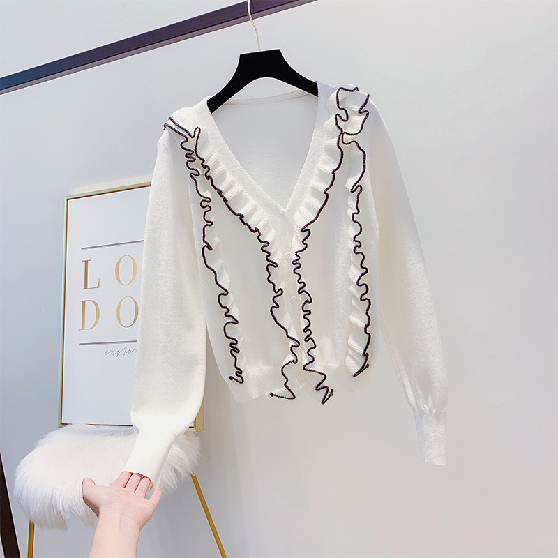 Modern női pulóver spitz nyakkivágással, fehér és fekete színben