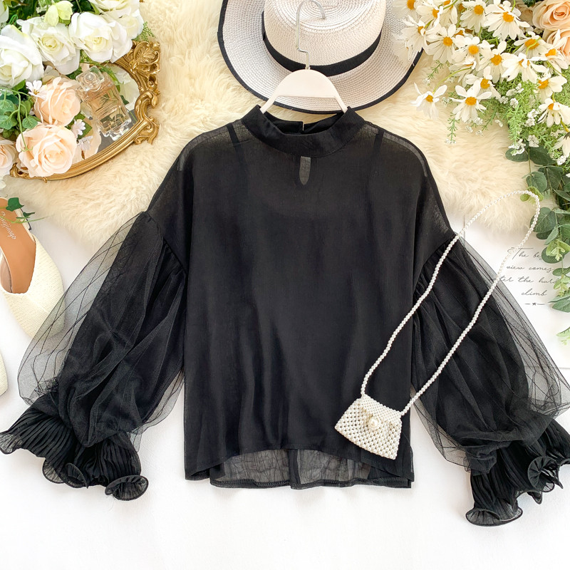 Modern női blúz ovális nyakkivágással és széles ujjakkal, többféle színben