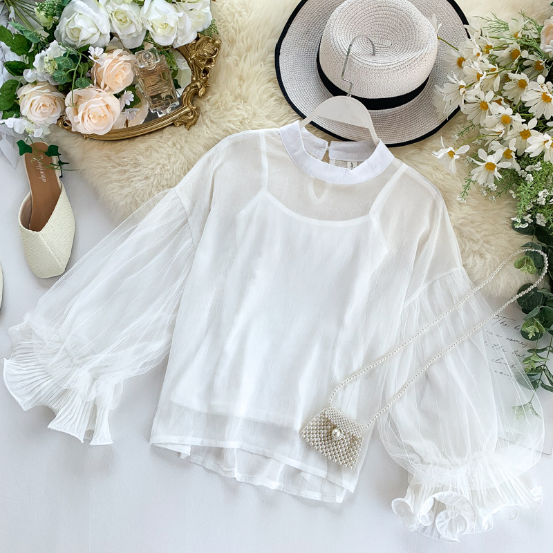 Modern női blúz ovális nyakkivágással és széles ujjakkal, többféle színben