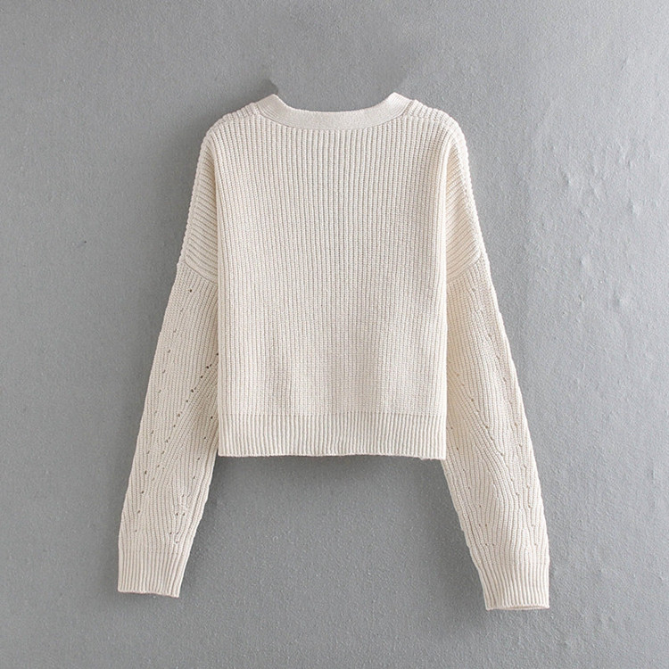 Rövid, bézs színű női mellény gombokkal és spitz nyakkivágással