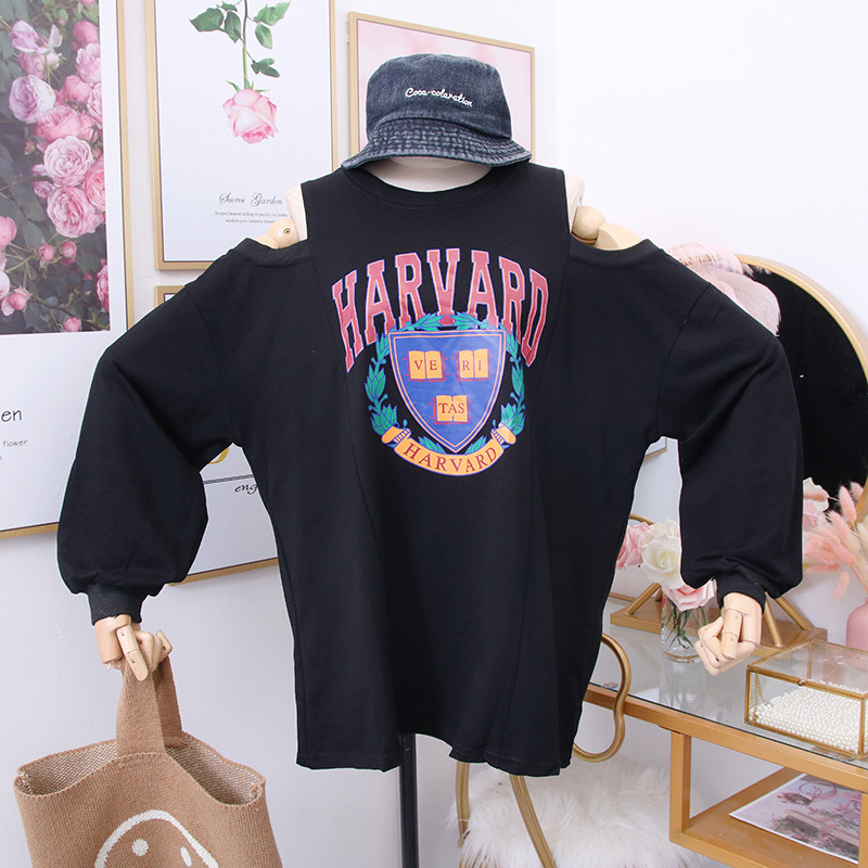 Új modell női blúz kivágott részekkel, fehér, fekete és szürke mintával