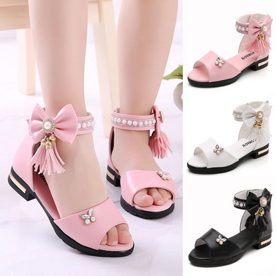 Children`s elegant sandals with tassels and ribbon in different colors
