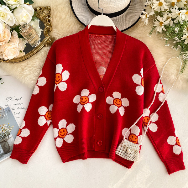 Alkalmi női kardigán piros és kék gombokkal