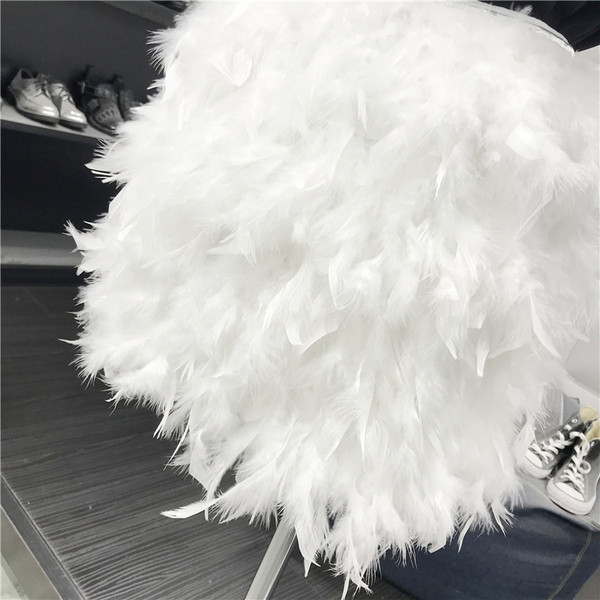 Νέο μοντέλο μοντέρνα γυναικεία φούστα με φτερά σε μαύρο και άσπρο