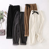 Modern női nadrág zsebekkel és nyakkendőkkel - széles modell