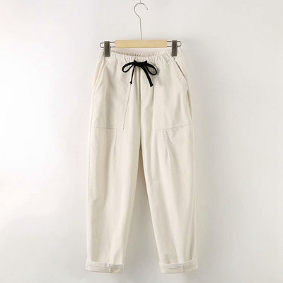 Modern női nadrág zsebekkel és nyakkendőkkel - széles modell