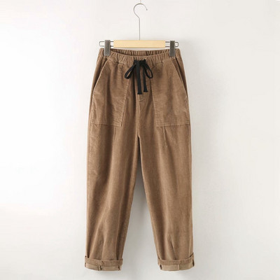 Modern női nadrág zsebekkel és nyakkendőkkel - széles modell