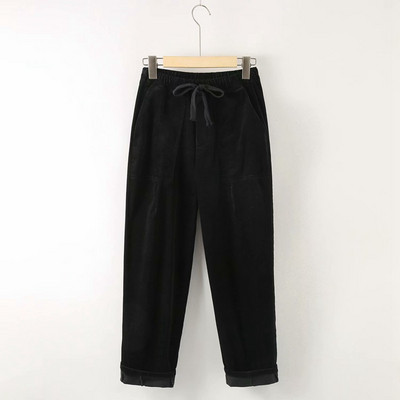 Modern női nadrág zsebekkel és nyakkendőkkel - széles modell