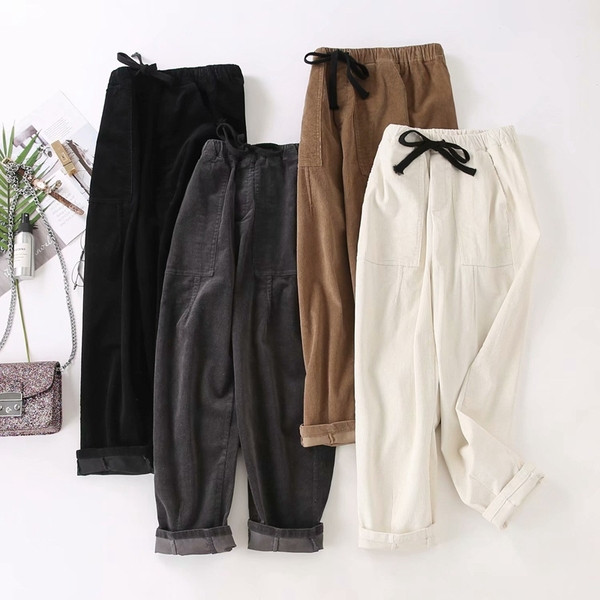 Modern női nadrág zsebekkel és nyakkendőkkel - széles modell