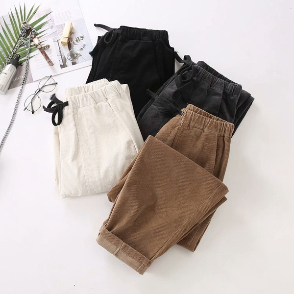 Modern női nadrág zsebekkel és nyakkendőkkel - széles modell