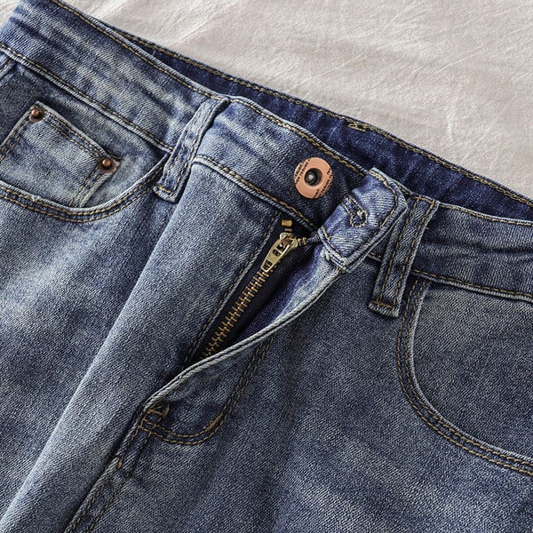 Női hosszú farmer szakadt motívummal, magas derékkal, kék színben