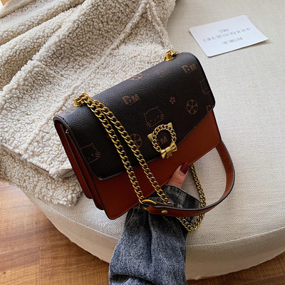 Stílusos kézitáska fém elemekkel több színben