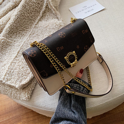 Stílusos kézitáska fém elemekkel több színben