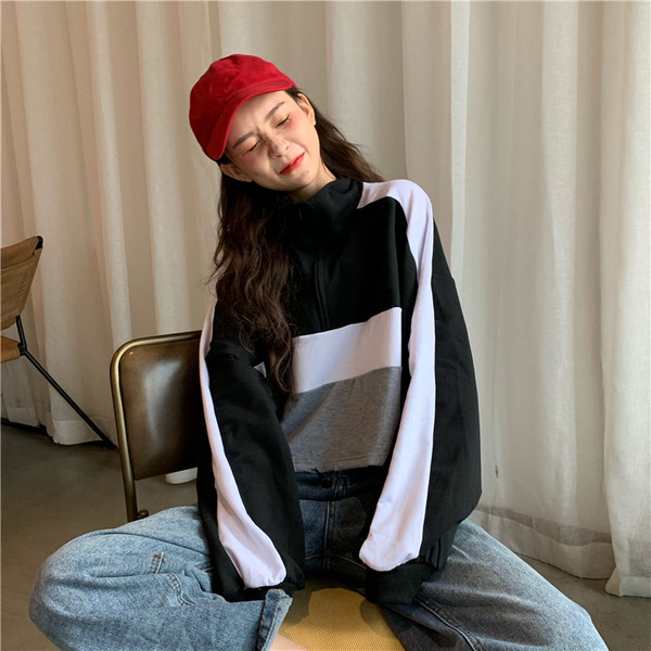 Női rövid blúz két színben, cipzárral