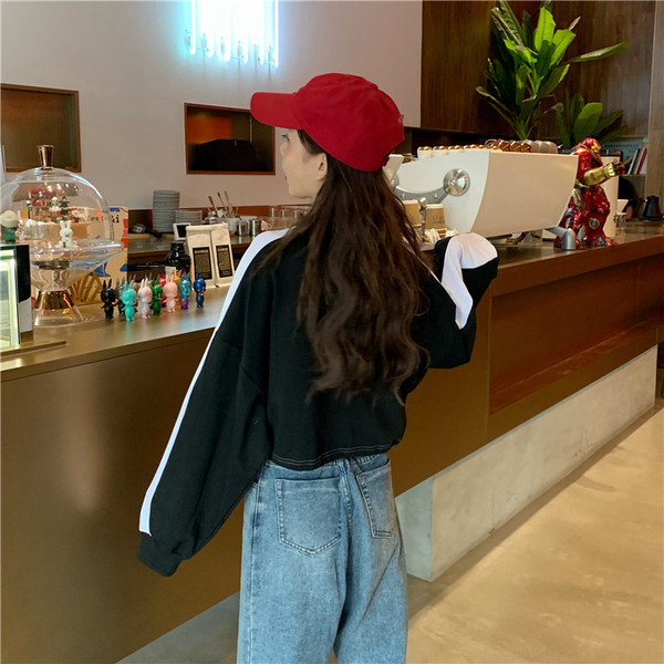 Női rövid blúz két színben, cipzárral