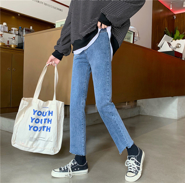 Női farmer kék színben, zsebbel és magas derékkal