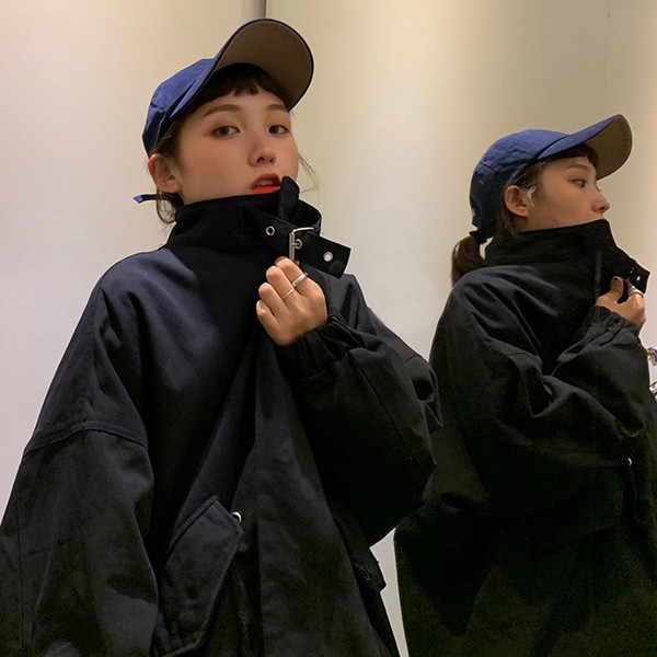 Női széles kabát két színben fűzős