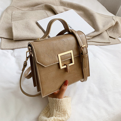 Modern női táska fém rögzítéssel és két füllel