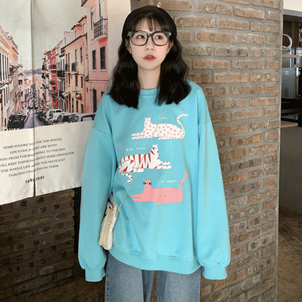 Kék színű széles női blúz, rátéttel