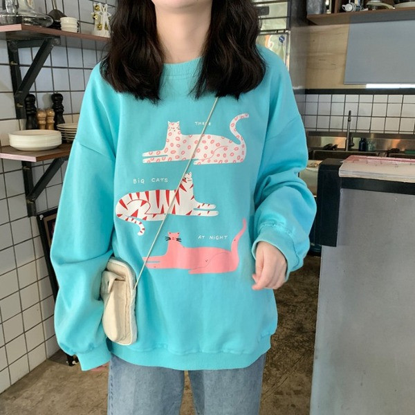 Kék színű széles női blúz, rátéttel