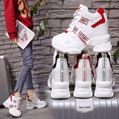 Modern women`s sneakers with colorful inscriptions and platform