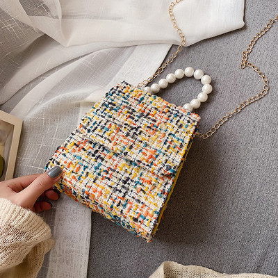 Κομψή γυναικεία τσάντα με μικρή λαβή και επιπλέον ιμάντα ώμου