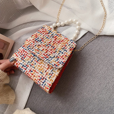 Κομψή γυναικεία τσάντα με μικρή λαβή και επιπλέον ιμάντα ώμου