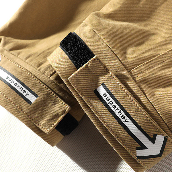 Divatos férfi nadrág fűzővel és zsebbel fekete és barna színben