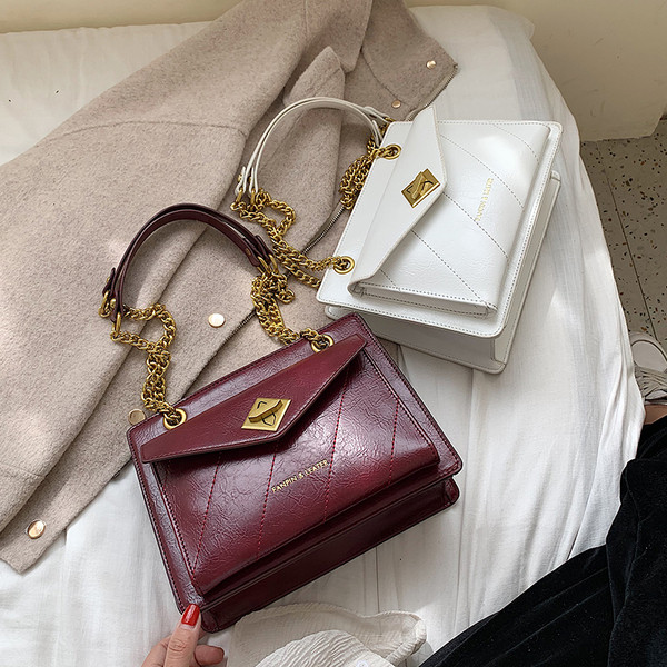 Női bőr táska fém lánccal több színben