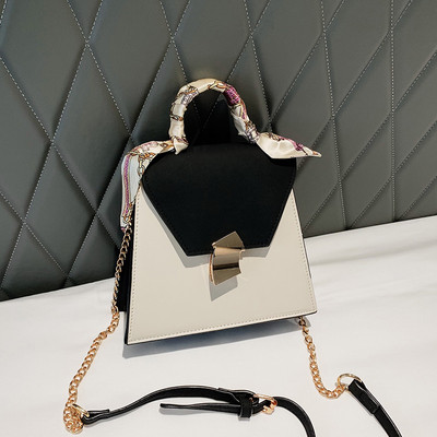 Stílusos női táska fém rögzítéssel több színben