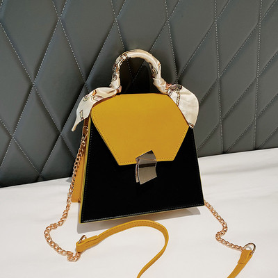 Stílusos női táska fém rögzítéssel több színben