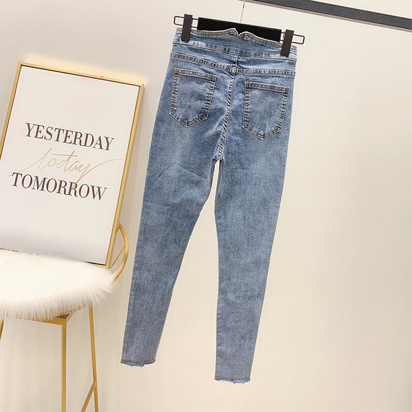 Modern női farmer magas derékkal és kék gombokkal