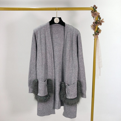 Hosszú női mellény rögzítés nélkül, zsebekkel és pehellyel