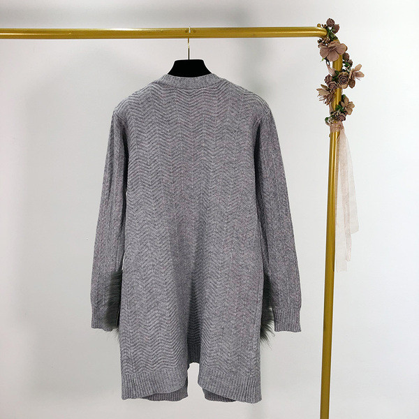 Hosszú női mellény rögzítés nélkül, zsebekkel és pehellyel