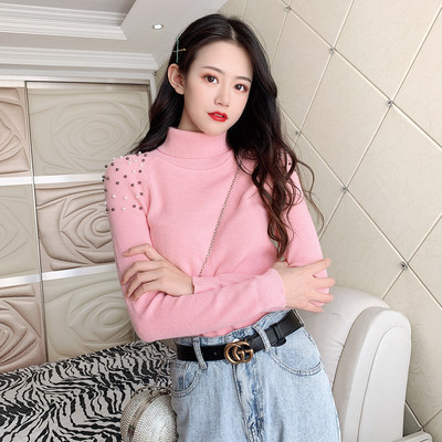 Modern női pulóver gyöngyökkel és magas gallérral