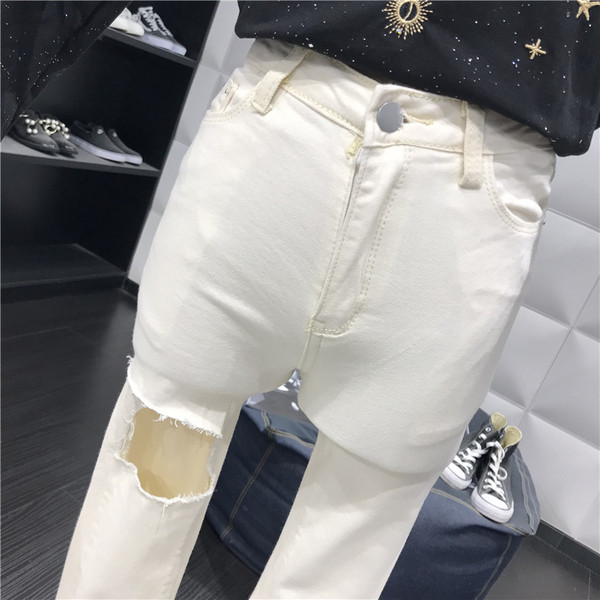 Modern női farmer, szürke és fehér szakadt motívumokkal