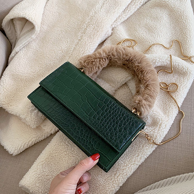 Stílusos női táska pehelytal és két fogantyúval