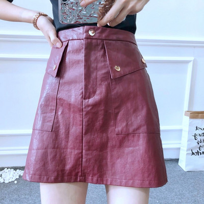 Öko bőrből készült rövid női szoknya két színben, magas derékkal és zsebekkel