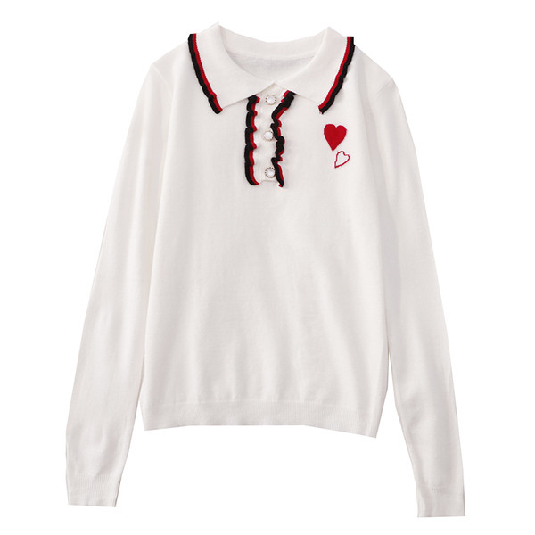 Fekete-fehér női blúz gombokkal és klasszikus gallérral