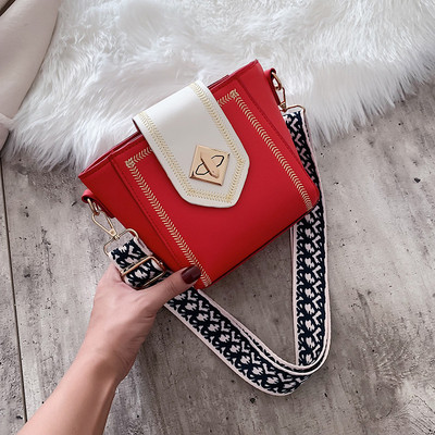 Modern női táska hímzett elemekkel és vastag fogantyúval