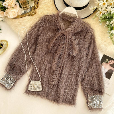 Modern női pulóver szalaggal és flitterekkel több színben