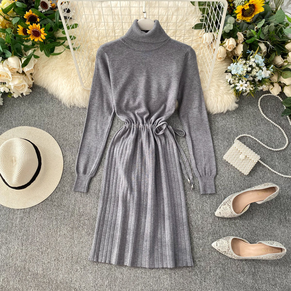 Új modell női ruha magas gallérral, derékkötővel, különböző színekben