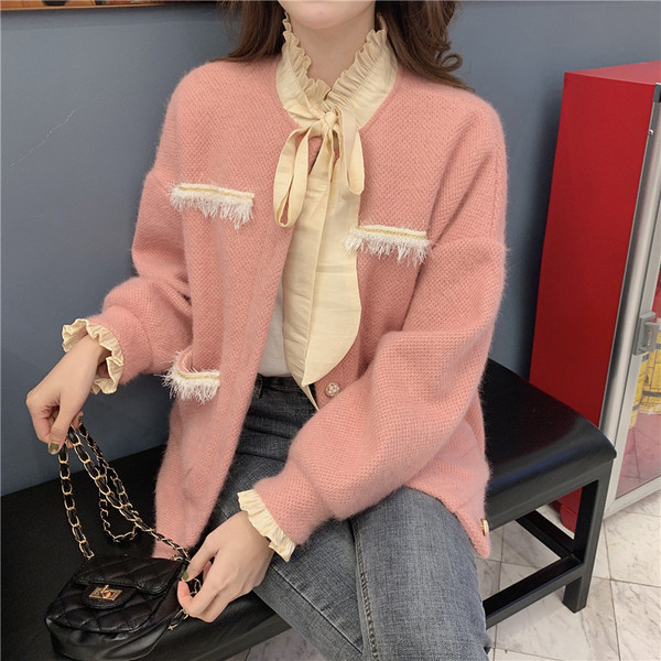 Modern női kardigán rózsaszín színű zsebekkel és magas gallérral