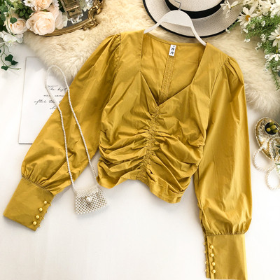 Női ing spitz nyakkivágással, ujjain gombokkal, többféle színben