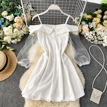 Modern női ruha fehér és fekete gombokkal