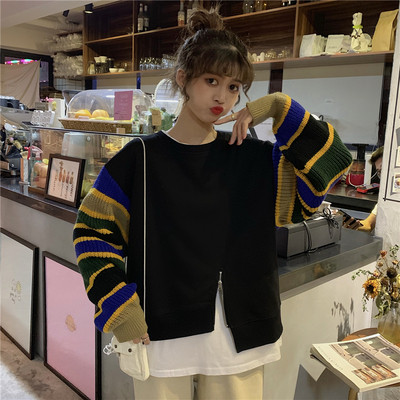 Modern női blúz színes ujjakkal és cipzárral